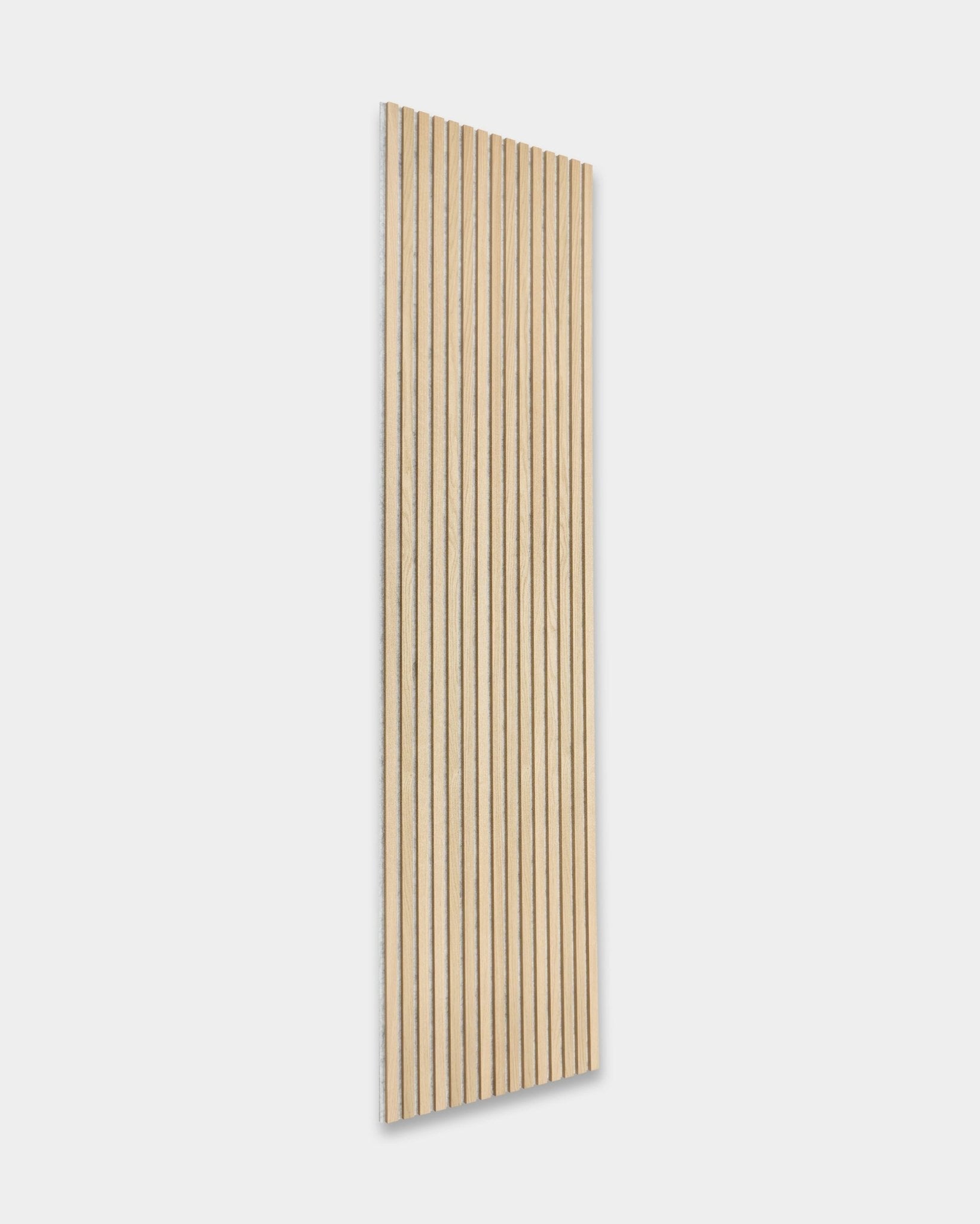 Akupanel acoustic panel by WoodUpp in Classic Oak with grey felt (300x60 cm) provides minimalist Nordic style contrast on light walls.