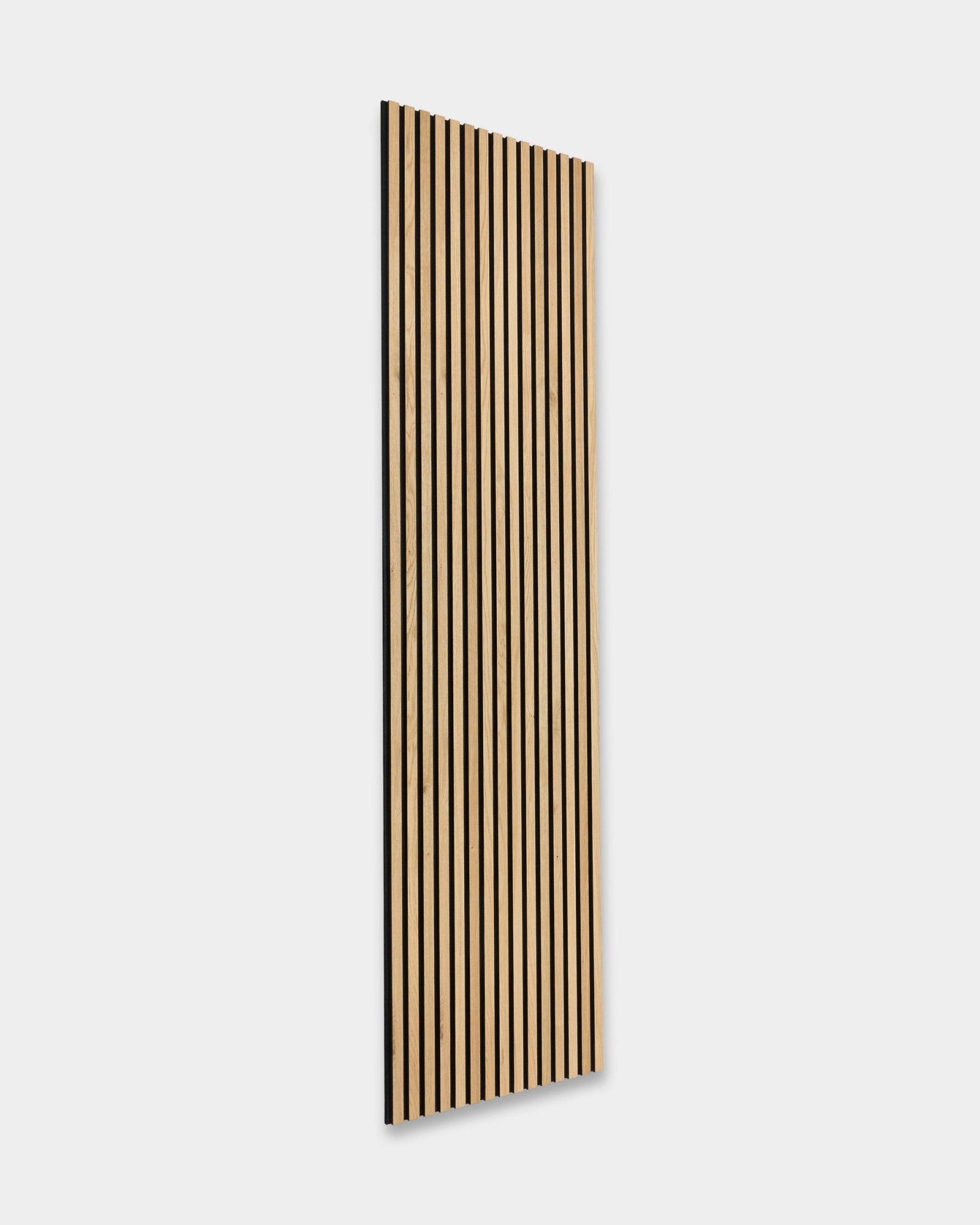 The Rustic Akupanel in Natural Oak (300x60 cm) by WoodUpp leans to the right against a light gray background, showcasing Nordic acoustic panel design.