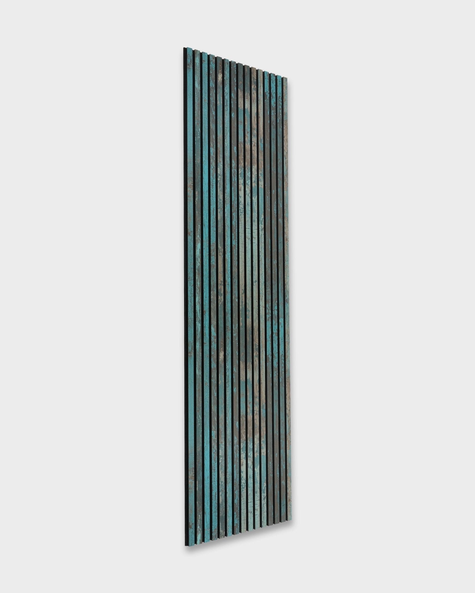 WoodUpp Akupanel Rebel in Oxide Blue (240x60 cm), a Nordic acoustic panel featuring vertical wood slats in blue, green, and brown.
