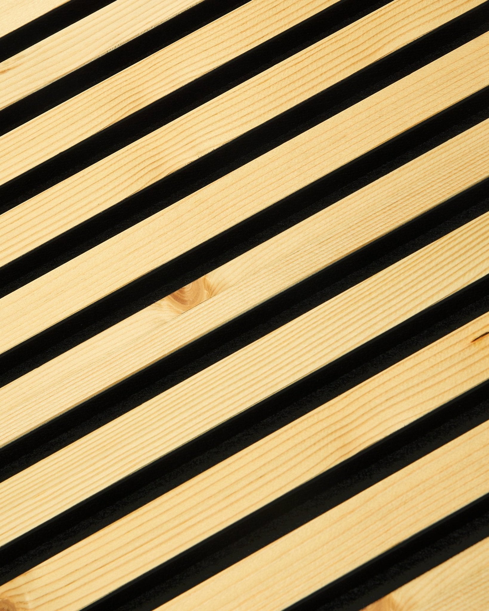 Close-up of WoodUpp Akupanel Rustic | Alp, 240 x 60 cm acoustic panel with diagonal wood slats, dark gaps, and minimalist Scandinavian design.