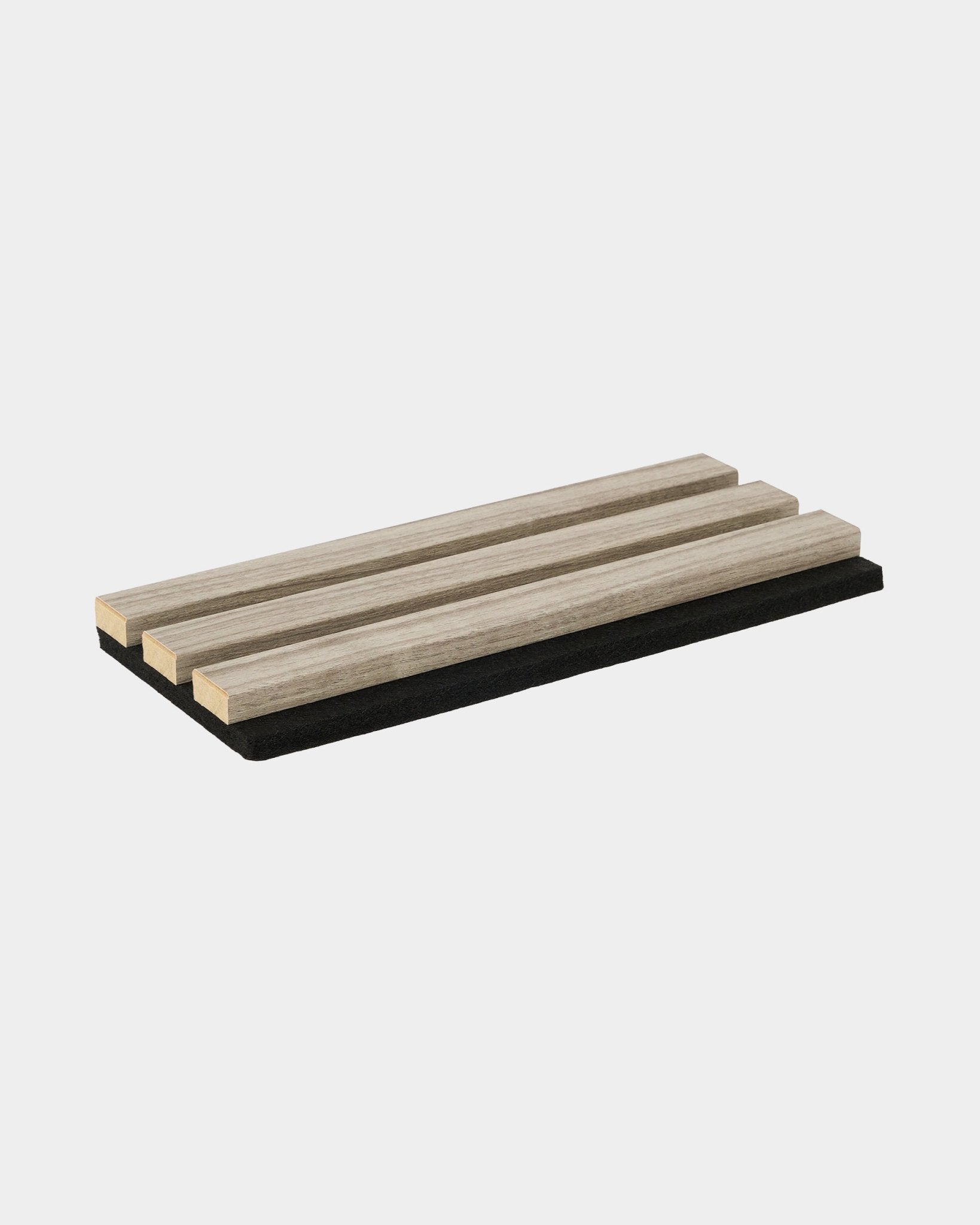 WoodUpp Essential Weathered Oak trivet sample with three oak slats on a black base, designed to protect kitchen surfaces and complement Nordic interiors.