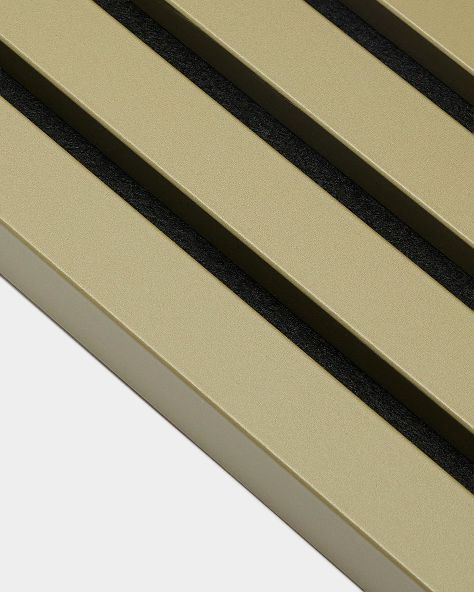 Close-up of WoodUpp Akupanel End Lamella in Moss, 2.2 cm: gold metallic acoustic panel with three parallel diagonal black grooves.