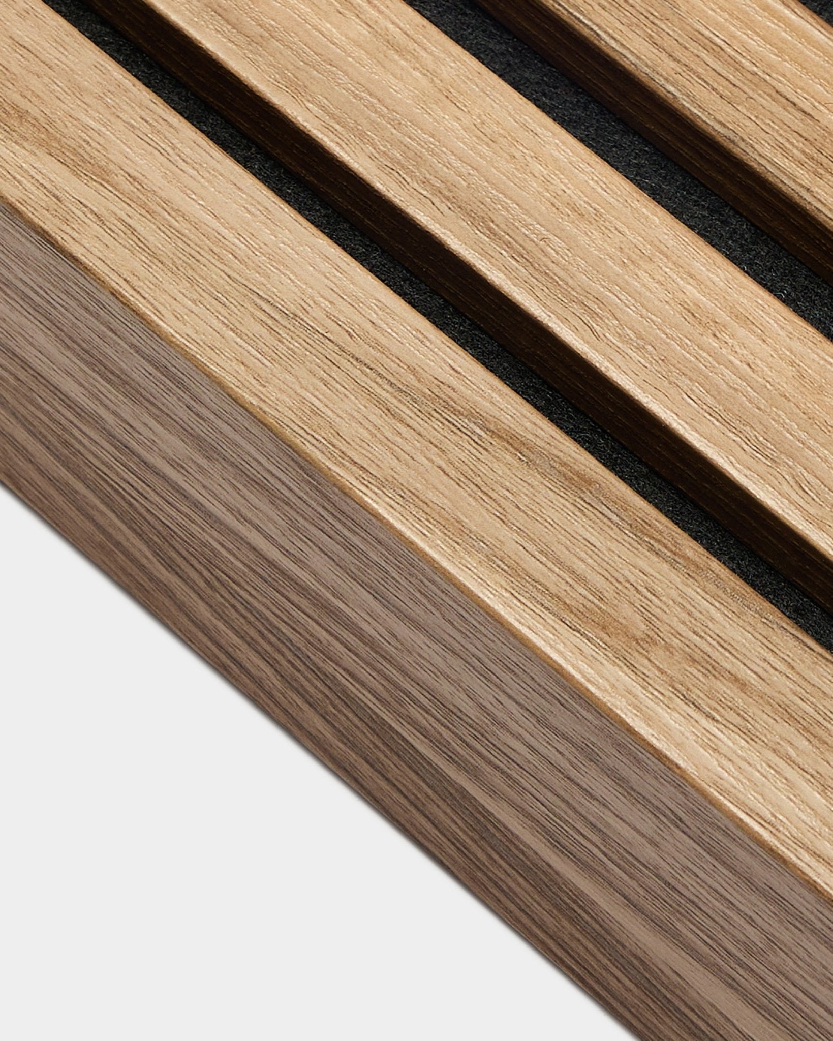 Close-up of WoodUpp Akupanel End lamella in English Walnut (6.7 cm), showing black gaps between acoustic slats against a plain white background.