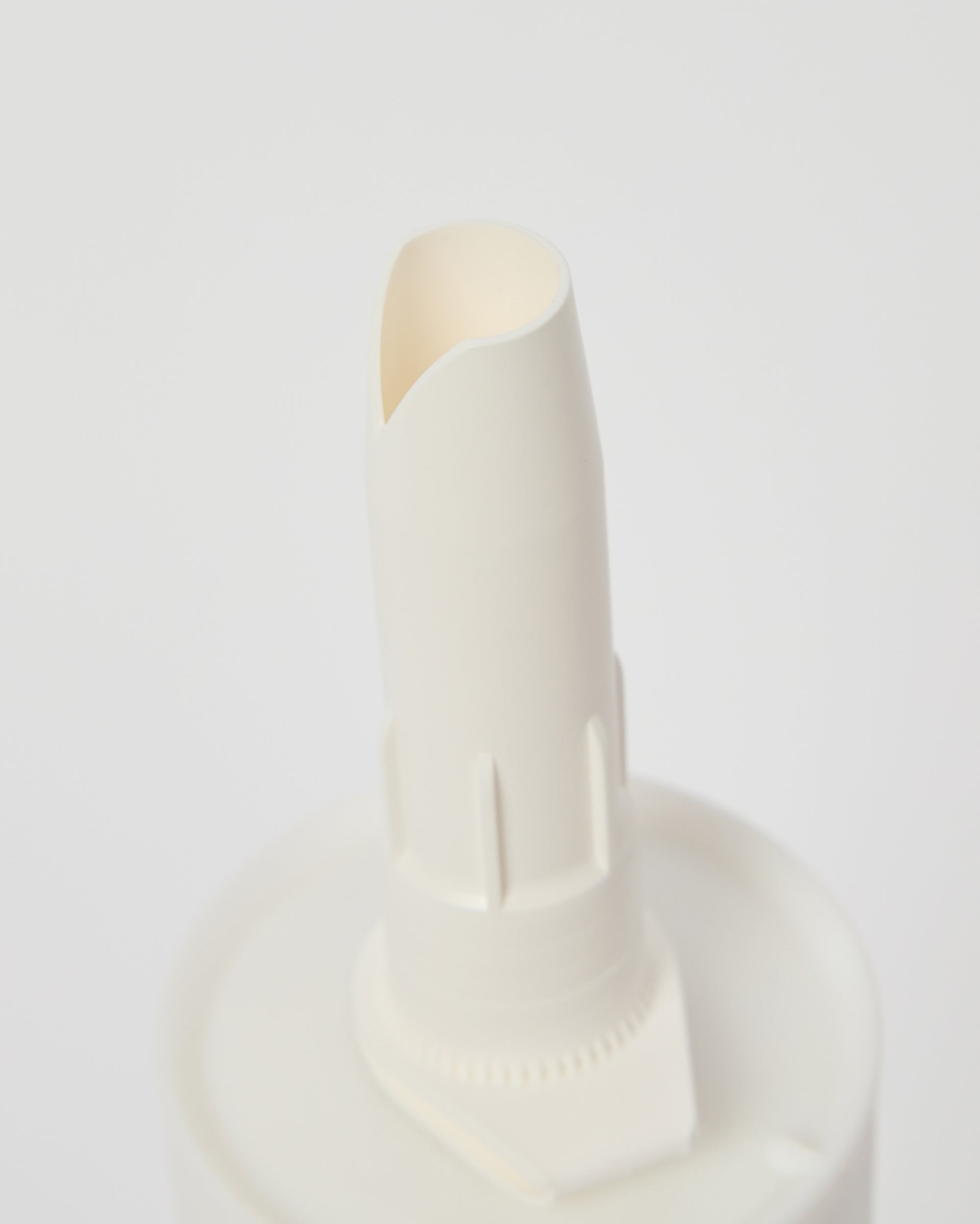 Close-up of WoodUpp CREATE Mounting Glue nozzle designed for precise adhesive application when installing Akupanel acoustic panels.