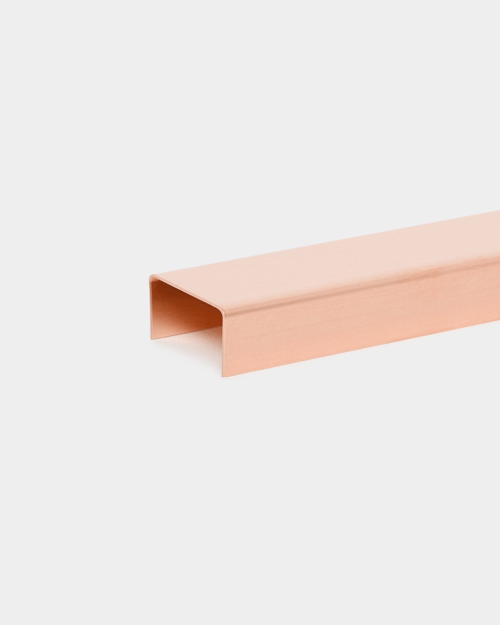 The Liva | Cover / Copper, 60 cm by WoodUpp is a copper-colored metal acoustic panel designed for use as a decorative accent on white walls.