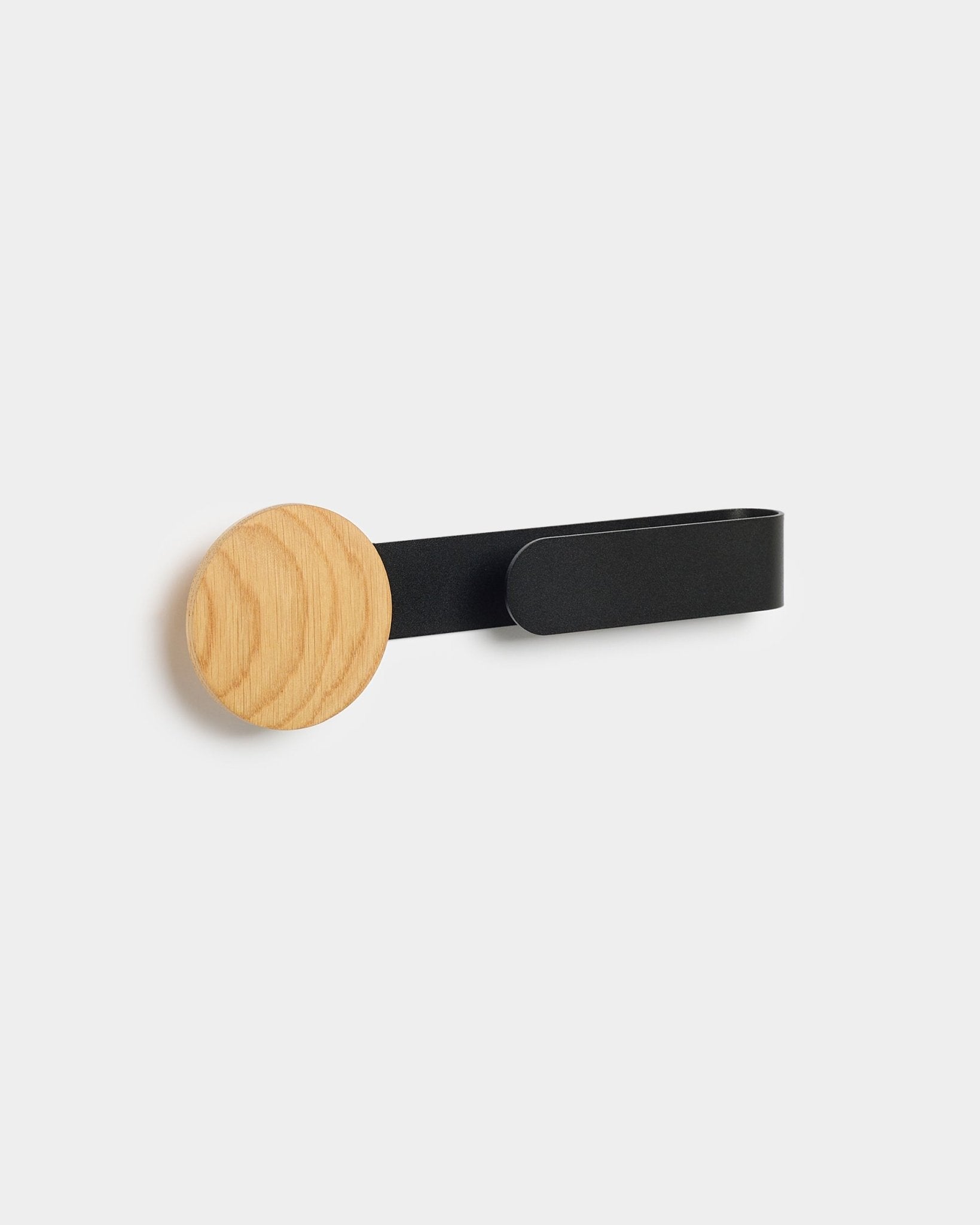 Linn Horizontal Hanger by WoodUpp with a natural oak knob and black metal arm, designed to complement your Akupanel acoustic panel.