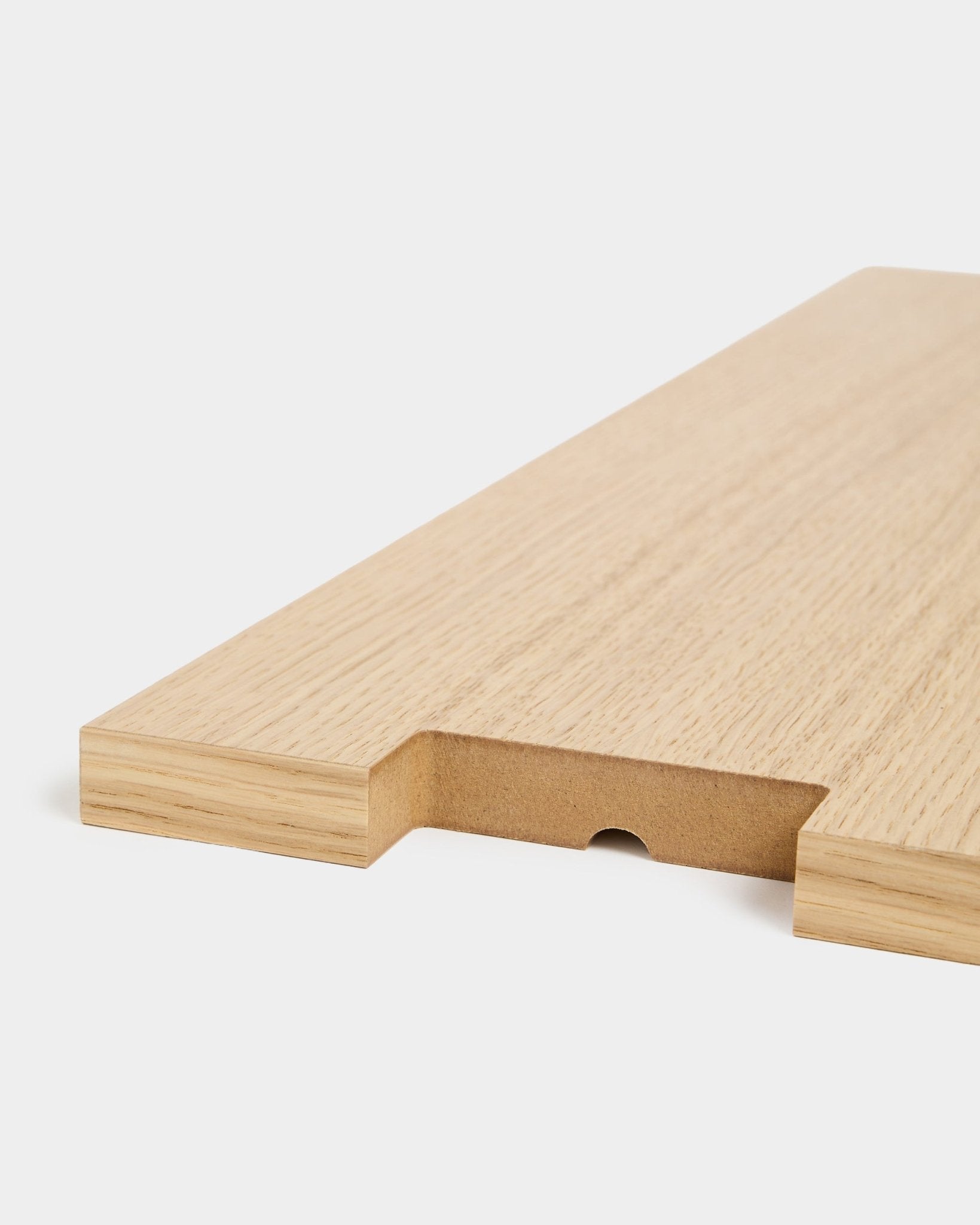 Lova | Wood Shelf BM2 in oak veneer by WoodUpp, 65.8 x 20 cm, shown close-up with a notched cut-out and half-circle groove on a white background.