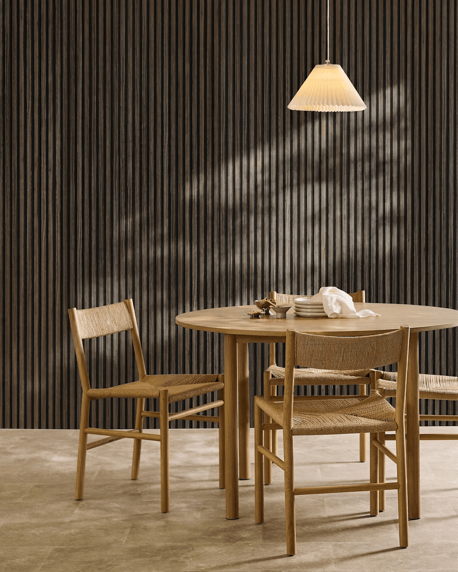 Akupanel in Black Oak with black felt in a dining area.